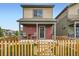 Attractive two-story home with a charming fenced front yard at 1199 Hummingbird Cir, Longmont, CO 80501