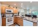 Kitchen featuring a breakfast bar and ample counter space at 1199 Hummingbird Cir, Longmont, CO 80501