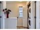 Hallway featuring closet laundry with stacked washer and dryer at 1199 Hummingbird Cir, Longmont, CO 80501
