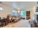 Bright living room with neutral colors, comfortable seating, and ample natural light at 1199 Hummingbird Cir, Longmont, CO 80501