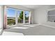 Bright bedroom with large windows, offering a scenic view of the outside landscape at 2230 Rim Ridge Dr, Castle Pines, CO 80108