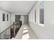 Upstairs hallway with carpet and large windows providing ample natural light at 2230 Rim Ridge Dr, Castle Pines, CO 80108