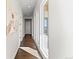 Bright hallway with natural light from windows and stylish artwork on the wall at 2230 Rim Ridge Dr, Castle Pines, CO 80108