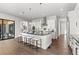 Spacious kitchen with large island, stainless steel appliances, and plenty of storage at 2230 Rim Ridge Dr, Castle Pines, CO 80108