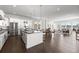 Spacious open-concept kitchen with island, stainless steel appliances and a breakfast nook at 2230 Rim Ridge Dr, Castle Pines, CO 80108