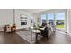 Bright living room with modern fireplace, large windows, and contemporary furniture at 2230 Rim Ridge Dr, Castle Pines, CO 80108