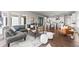 Open-concept living space with comfortable seating and easy access to kitchen and dining area at 2230 Rim Ridge Dr, Castle Pines, CO 80108