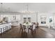 Bright open floor plan featuring hardwood floors, modern decor, and seamless flow at 2230 Rim Ridge Dr, Castle Pines, CO 80108