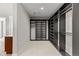 This walk-in closet offers ample shelving, storage and bright, clean, neutral finishes at 2230 Rim Ridge Dr, Castle Pines, CO 80108