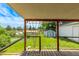 A view of the backyard featuring a shed as seen from the covered porch at 3182 W Radcliff Dr, Englewood, CO 80110