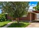 Well-maintained brick home with manicured lawn, mature tree, and walkway, offering great curb appeal at 3182 W Radcliff Dr, Englewood, CO 80110