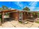 Cozy red brick home with a covered carport and a porch, offering a welcoming outdoor space at 3182 W Radcliff Dr, Englewood, CO 80110