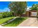 Well-maintained brick home with a driveway and detached garage at 3182 W Radcliff Dr, Englewood, CO 80110