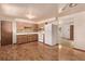 Bright eat in kitchen with wooden cabinets and lots of counter space at 3182 W Radcliff Dr, Englewood, CO 80110