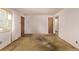 Bright living room with neutral walls, wall-to-wall carpet, and lots of natural light at 3182 W Radcliff Dr, Englewood, CO 80110