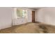 Open living space with natural light streaming through a large window at 3182 W Radcliff Dr, Englewood, CO 80110