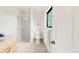 Bright bathroom featuring a glass shower, toilet, and natural light at 3260 Bit Rd, Evergreen, CO 80439