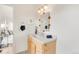 Bathroom with wooden vanity, vessel sink, and decorative mirror at 3260 Bit Rd, Evergreen, CO 80439
