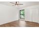 Bedroom with hardwood floors, a closet, and a large window at 3260 Bit Rd, Evergreen, CO 80439