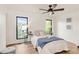 Bright bedroom with hardwood floors, modern furnishings, and ample natural light at 3260 Bit Rd, Evergreen, CO 80439