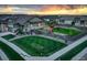 Aerial view of a single-Gathering home featuring a landscaped yard with a deck, pergola, and a play structure at 7029 Sagerock St, Castle Pines, CO 80108