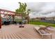 Inviting backyard features a pergola, lounge chairs, and string lights perfect for outdoor relaxation and entertaining at 7029 Sagerock St, Castle Pines, CO 80108