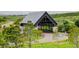 Exterior image of a covered bridge surrounded by lush greenery showcasing its architectural beauty and natural setting at 7029 Sagerock St, Castle Pines, CO 80108