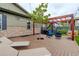Outdoor deck featuring a pergola, outdoor seating, and a built-in tree planter at 7029 Sagerock St, Castle Pines, CO 80108
