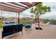 Outdoor living space featuring a pergola, built in swing and a view of the neighborhood at 7029 Sagerock St, Castle Pines, CO 80108