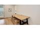 Bright dining area features a modern table with benches and wood flooring at 7029 Sagerock St, Castle Pines, CO 80108