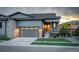 Charming home featuring stone accents, a two-car garage, and well-maintained landscaping at 7029 Sagerock St, Castle Pines, CO 80108