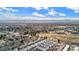 Expansive aerial view showcasing the community and its proximity to parks, mountains, and the surrounding cityscape at 1169 S Reed Way, Lakewood, CO 80232