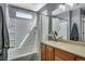 Neutral bathroom with a tub and shower, vanity, and a mirror at 14803 E 119Th Ave, Commerce City, CO 80603