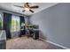 Bedroom with gray walls, a ceiling fan, and carpeted floors at 14803 E 119Th Ave, Commerce City, CO 80603