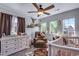Adorable Bedroom with unique decor, a rocker, and a crib at 14803 E 119Th Ave, Commerce City, CO 80603