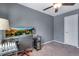Bedroom with gray walls, a ceiling fan, and carpeted floors at 14803 E 119Th Ave, Commerce City, CO 80603