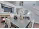 Elegant dining area boasts wood floors, a fireplace and is open to the upper level at 14803 E 119Th Ave, Commerce City, CO 80603