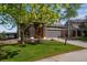 Charming two-story home with a well-manicured lawn, a two-car garage, and a welcoming front porch at 14803 E 119Th Ave, Commerce City, CO 80603