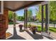 Inviting front porch with colorful flower pots, brick accents, and a view of the neighborhood at 14803 E 119Th Ave, Commerce City, CO 80603