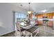 Kitchen dining area featuring stainless appliances and a light-filled sliding glass door at 14803 E 119Th Ave, Commerce City, CO 80603