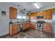 Bright kitchen with stainless steel appliances and ample cabinet space at 14803 E 119Th Ave, Commerce City, CO 80603
