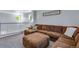 Upstairs living room offers a large sectional sofa, an upstairs railing, and natural light at 14803 E 119Th Ave, Commerce City, CO 80603