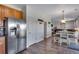 Spacious open layout from the kitchen through to the dining and living areas at 14803 E 119Th Ave, Commerce City, CO 80603