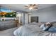 This main bedroom boasts neutral paint, wood-look floors, and modern furniture at 14803 E 119Th Ave, Commerce City, CO 80603