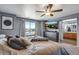 Neutral main bedroom features a ceiling fan, and an ensuite bathroom at 14803 E 119Th Ave, Commerce City, CO 80603