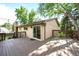 Inviting backyard deck with string lights, a grill, and a door leading into the house at 6742 Cole Cir, Arvada, CO 80004
