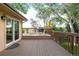 Inviting backyard deck with string lights, a grill, and a sliding glass door to the house at 6742 Cole Cir, Arvada, CO 80004
