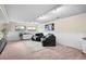Spacious basement featuring comfortable armchairs, a large rug, and recessed lighting at 6742 Cole Cir, Arvada, CO 80004