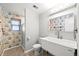 Bathroom with vintage wallpaper, gray walls, a modern sink, and a glass enclosed shower at 6742 Cole Cir, Arvada, CO 80004