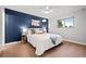 Cozy bedroom featuring a plush bed, dark accent wall, and warm lighting creating a relaxing ambiance at 6742 Cole Cir, Arvada, CO 80004